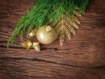Christmas Fir Tree With Decoration On Dark Wooden Board Stock Photo