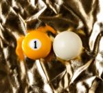 Billiard Balls On Golden Surface Stock Photo