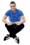 Young Guy Enjoying Music And Using Tablet Pc Stock Photo