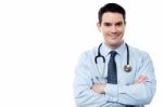 Senior Smiling Male Doctor At Work Stock Photo