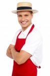 Young Chef Wearing Straw Hat Stock Photo