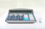 Calculator On A White Table Stock Photo