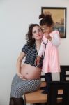 Pregnant Woman And Her Daughter Stock Photo