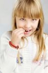 Girl Eating Candy Stock Photo