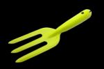 Small Gardening ,  Green Fork Isolated On Black Background Stock Photo