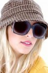 Female Wearing Sunglasses And Cap Stock Photo