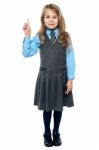I Know The Answer. School Girl Raising Hand Stock Photo