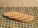A Pile Of Hot Cup Serving Tray Made Of Compressed Sawdust On A Woven Bamboo Chair Stock Photo