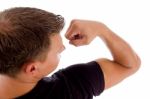 Man Showing Muscles Stock Photo