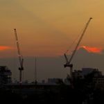 Crane In Construction Sites At Twilight Stock Photo