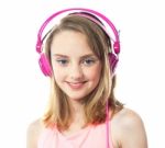 teenage Girl Wearing Pink Headphone Stock Photo