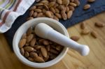 Almonds With A Mortar & Pestle Stock Photo