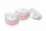 Two Pink Triangle Cosmetic Jar On White Background Stock Photo