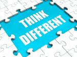 Think Different Puzzle Shows Thinking Outside The Box Stock Photo