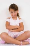Smiling Girl With Crossed Arms Stock Photo