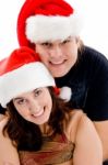 Young Couple Wearing Christmas Hat Stock Photo