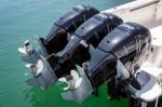 Three Outboard Engines On A Boat In Puerto Banus Harbour Stock Photo