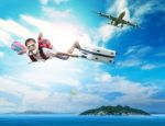 Young Man Flying On Blue Sky Wearing Snorkeling Mask And Holding Stock Photo