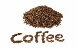 Word Coffee With Heap Of Coffee Beans Stock Photo