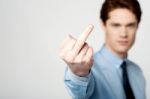 Corporate Guy Showing Middle Finger Stock Photo