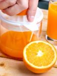 Freshly Squeezed Juice Shows Healthy Orange Drink And Drinking Stock Photo