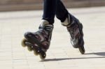Close-up View Of Male Legs In Roller Blades Stock Photo