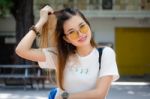 Portrait Of Thai Chinese Adult Glasses Beautiful Girl Denim Blue Bag Relax And Smile Stock Photo