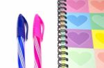Colorful Heart Graphic Cover Notebook, Diary With Colorful Pen Stock Photo