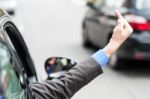 Man Showing Middle Finger From Car Window Stock Photo