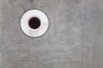 Top View Of Coffee Cup On Abstrsct Gray Concrete Background Stock Photo
