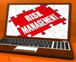 Risk Management On Laptop Showing Risky Analysis Stock Photo