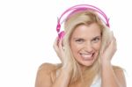 Hot Blonde Listening To Music Via Headphones Stock Photo