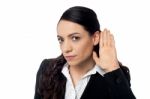 Business Woman With Hand To Ear Stock Photo