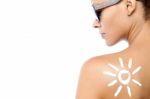 Young Woman With Sun Tan Lotion Stock Photo