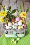 Easter Eggs In The Basket On Green Striped Cloth Stock Photo