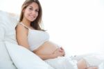 Pregnant Woman Relaxing At Home Stock Photo