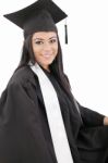 Female Graduate Wearing A Gown And Mortarboard Stock Photo