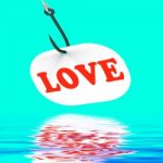 Love On Hook Displays Romantic Seduction Or Flirting Stock Photo