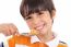 Smiling Young Boy With Spoon Of Flakes, Closeup