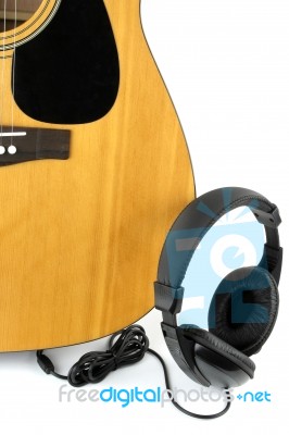 A Guitar And Head Phone Stock Photo
