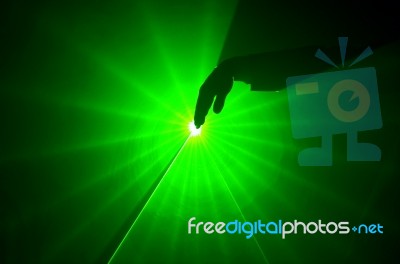 A Hand In A Green Light Stock Photo