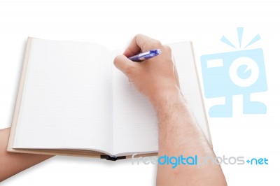 A Hand Is Writing On Blank Page Notebook Stock Photo