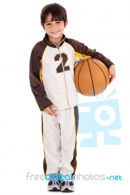 Adorable Young Kid In His Sports Dress With Ball Stock Photo