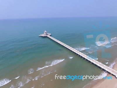 Aerial View Of Pier Bridge Into Blue Sea Stock Photo