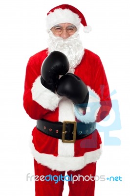 Aged Cheerful Santa Wearing Boxing Gloves Stock Photo