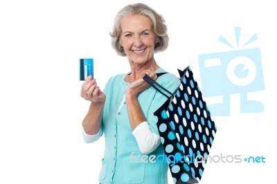 Aged Woman Displaying Her Cash Card Stock Photo