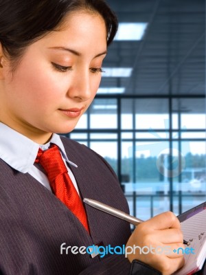Airport Staff Making Notes Stock Photo