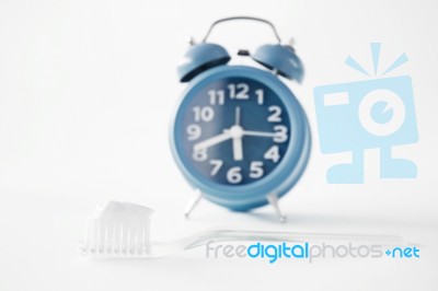 Alarm Clock And Toothbrush Stock Photo