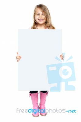 An Adorable Kid Showing Blank Whiteboard Stock Photo