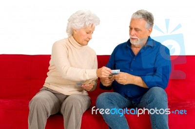 An Old Couple Holding Money Stock Photo